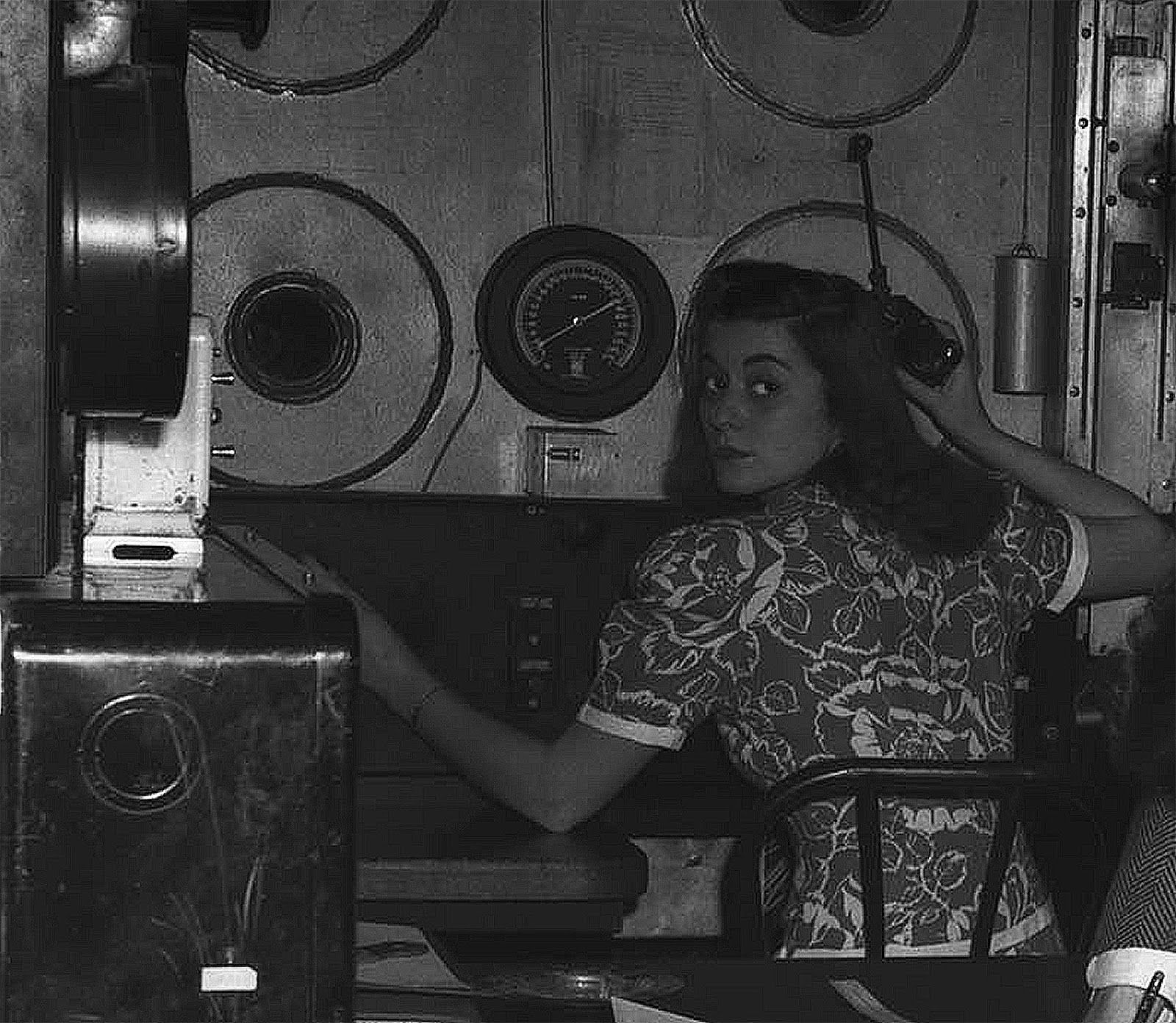 1960s photo of a woman operating a NASA instrument.