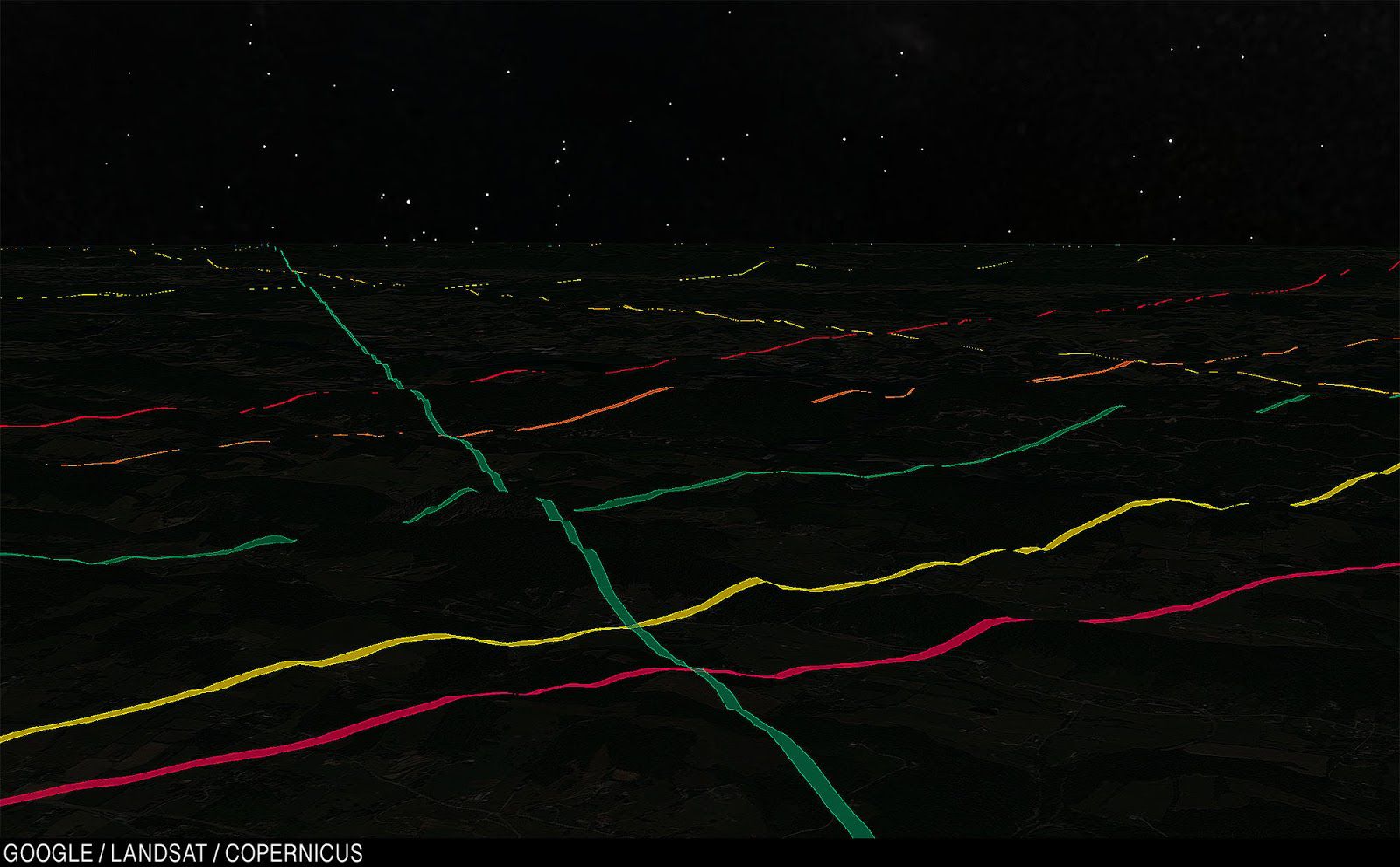 A tangle of fields run through an unspecified mountain range.